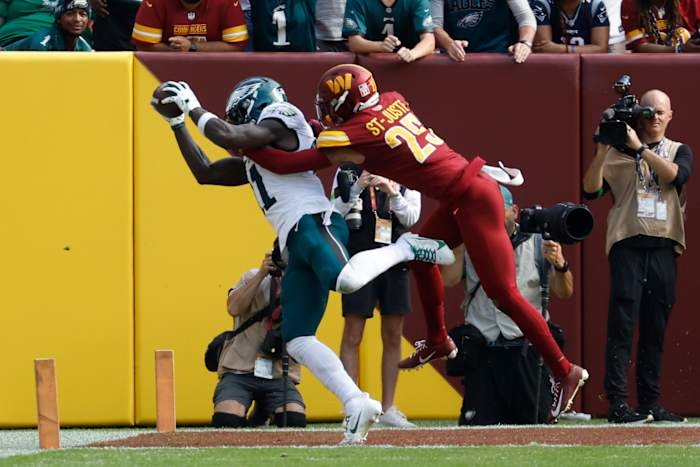 Philadelphia Eagles receiver A.J. Brown catches a touchdown against Washington Commanders cornerback Benjamin St-Juste.